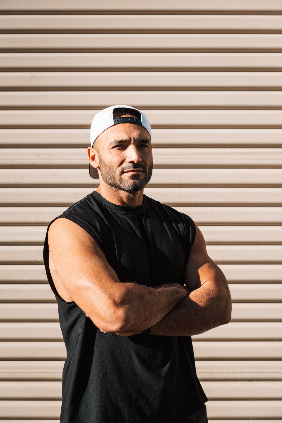 Nick in a focused portrait, arms crossed